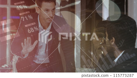 Digital composite of a Caucasian man explaining to diverse colleagues in an office while graphs move 115773287