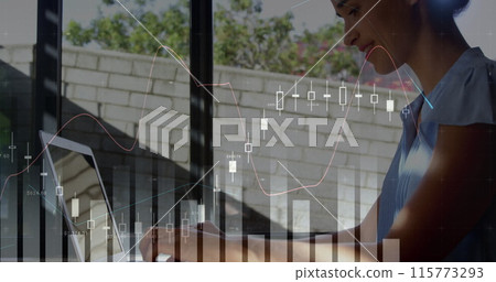 Digital composite of a Caucasian woman using a laptop during the day while graphs move in the foregr 115773293