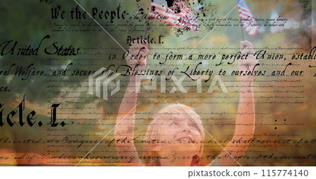 Digital composite of a Caucasian child holding out two American flags outdoors while a written const Digital composite of a Caucasian child holding out two American flags outdoors while a written const 115774140