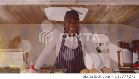 Image of spots of light floating over smiling african american fast food seller 115774272