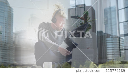 Image of statistic icons floating over albino african american man working on laptop at home Image of statistic icons floating over albino african american man working on laptop at home 115774289
