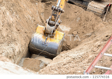 Working Excavator Tractor Digging A Trench. Working Excavator Tractor Digging A Trench. 115774316