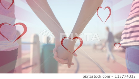 Image of hearts falling over diverse couple holding hands Image of hearts falling over diverse couple holding hands 115774332