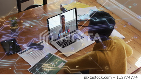 Image of microprocessor connections over african american woman having a image call on laptop Image of microprocessor connections over african american woman having a image call on laptop 115774774
