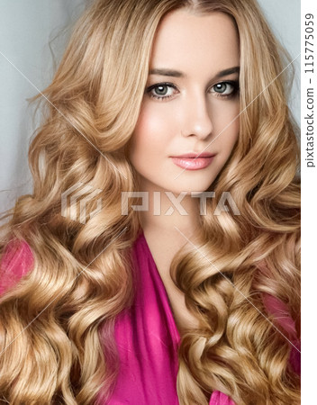 Beautiful blonde woman with curly volume hairstyle, long luxurious hair and beauty makeup, glamorous look face portrait for luxury fashion and natural cosmetics idea Beautiful blonde woman with curly volume hairstyle, long luxurious hair and beauty makeup, glamorous look face portrait for luxury fashion and natural cosmetics idea 115775059