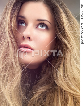 Beautiful modern blonde woman with volume hairstyle, long luxurious hair and beauty makeup, glamorous look face portrait for luxury fashion and natural cosmetics idea 115775208