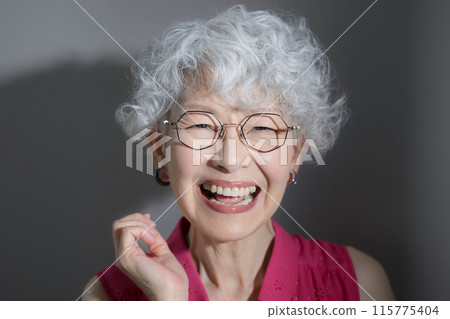 Close-up of a smiling gray-haired woman looking at the camera - skin care and beauty image Close-up of a smiling gray-haired woman looking at the camera - skin care and beauty image 115775404