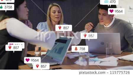 Image of social media data processing over diverse business people in office Image of social media data processing over diverse business people in office 115775726