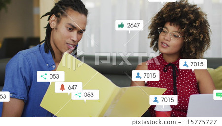 Image of social media data processing over diverse business people in office Image of social media data processing over diverse business people in office 115775727