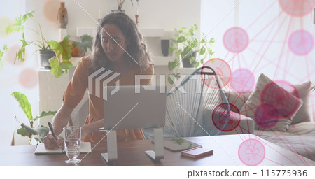 Image of network of connections with media icons over caucasian woman using tablet Image of network of connections with media icons over caucasian woman using tablet 115775936