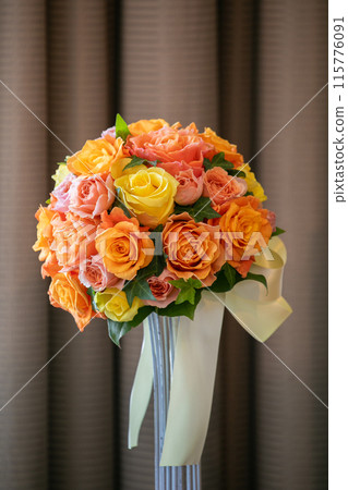 Orange and yellow bridal bouquet 115776091