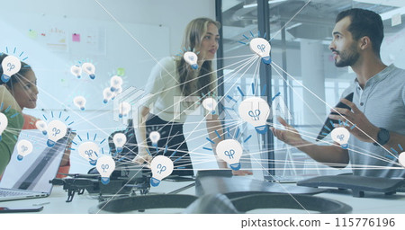Image of network of bulb icons over group of diverse colleagues discussing together at office Image of network of bulb icons over group of diverse colleagues discussing together at office 115776196