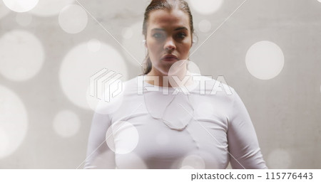 Image of spots of light over plus size caucasian woman in sports clothes flexing muscles Image of spots of light over plus size caucasian woman in sports clothes flexing muscles 115776443