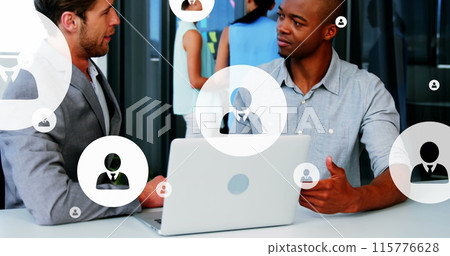 Image of multiple profile icons over diverse entrepreneurs sharing ideas in office 115776628