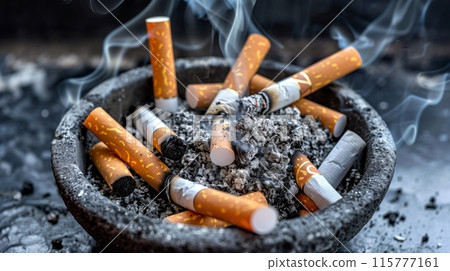 Burnt cigarette butts in an ashtray 115777161