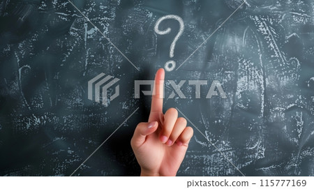 Question mark written on a blackboard and a pointing hand 115777169