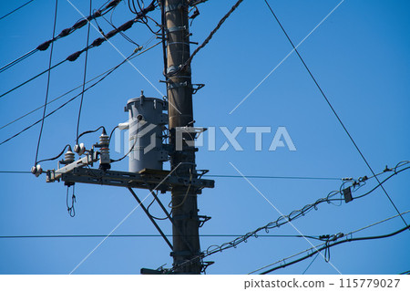 electric wire attached to a pole electric wire attached to a pole 115779027