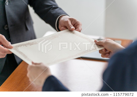Teachers handing out diplomas and certificates at a graduation ceremony and students receiving them (high school girls, high school students, and junior high school students) 115779072