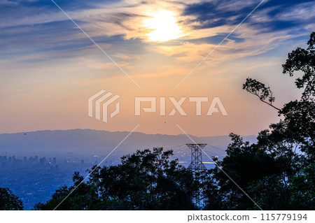 Evening view from the observation deck at 600m above sea level on the Shigiikoma Skyline, bordering Nara and Osaka prefectures. Medium telephoto zoom. The sun sets, dyed golden ⑧ 115779194