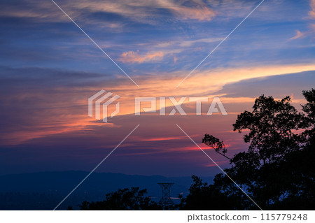 Evening view from the observation deck at 600m above sea level on the Shigiikoma Skyline, bordering Nara and Osaka prefectures. Medium telephoto zoom. Beautiful sunset sky① 115779248