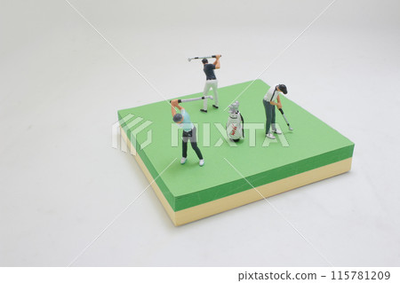 Golfer Figurine on Golf Ball on the memo pad Golfer Figurine on Golf Ball on the memo pad 115781209