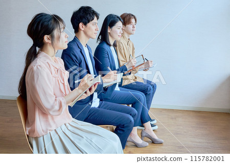 Business people taking notes in a conference room 115782001