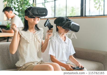 Children wearing VR goggles experiencing the virtual reality metaverse Children wearing VR goggles experiencing the virtual reality metaverse 115782165