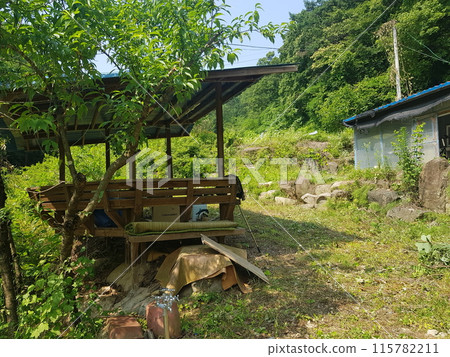 a small house on a construction site a small house on a construction site 115782211