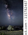 milky way over rocks 115782487