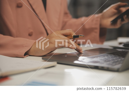 Work using mobile phone typing computer mobile chat laptop contact us at workplaces, planning ideas investors internet searching, ideas connecting people. 115782639