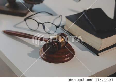 Law theme, gavel or mallet of the judge, lawyer enforcement officers, evidence-based cases taken into account in the court abount business, legislation. Law theme, gavel or mallet of the judge, lawyer enforcement officers, evidence-based cases taken into account in the court abount business, legislation. 115782731