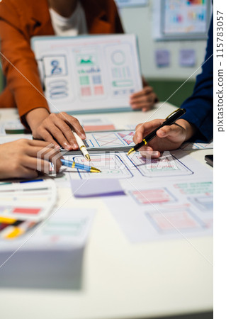 UX developer and ui designer brainstorming about mobile app interface wireframe design with customer breif and color code, User experience concept.. UX developer and ui designer brainstorming about mobile app interface wireframe design with customer breif and color code, User experience concept.. 115783057