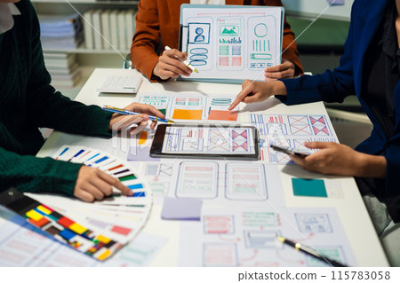 UX developer and ui designer brainstorming about mobile app interface wireframe design with customer breif and color code, User experience concept.. UX developer and ui designer brainstorming about mobile app interface wireframe design with customer breif and color code, User experience concept.. 115783058