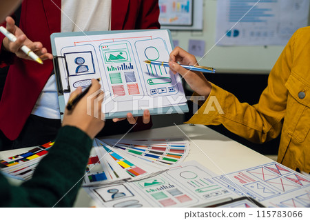 UX developer and ui designer brainstorming about mobile app interface wireframe design with customer breif and color code, User experience concept.. UX developer and ui designer brainstorming about mobile app interface wireframe design with customer breif and color code, User experience concept.. 115783066