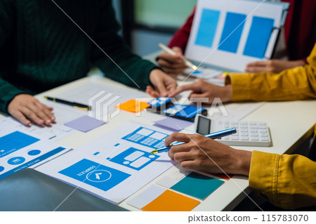 UX developer and ui designer brainstorming about mobile app interface wireframe design with customer breif and color code, User experience concept.. 115783070