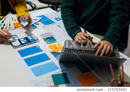 UX developer and ui designer brainstorming about mobile app interface wireframe design with customer breif and color code, User experience concept.. UX developer and ui designer brainstorming about mobile app interface wireframe design with customer breif and color code, User experience concept.. 115783082