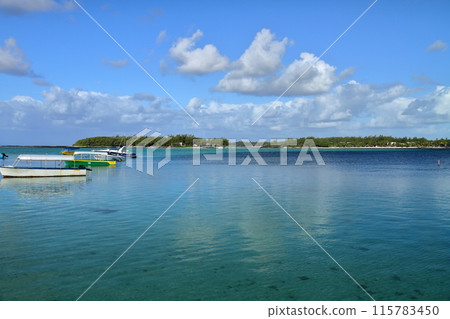 The island nation of Mauritius, also known as the Lady of the Indian Ocean, has a blue sea in Blue Bay, located on the southeast coast. 115783450