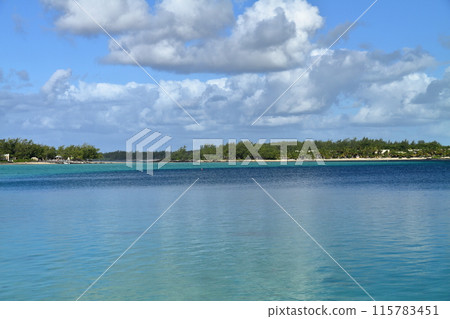 The island nation of Mauritius, also known as the Lady of the Indian Ocean, has a blue sea in Blue Bay, located on the southeast coast. 115783451
