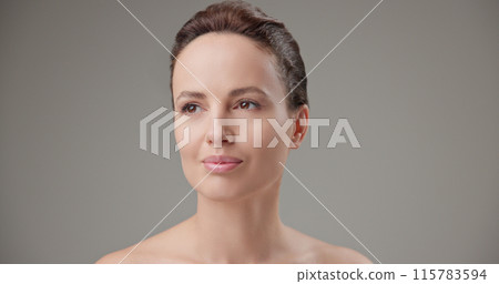 Beauty, health, cosmetics, anti-aging therapy and skin care concept - young beautiful brunette Caucasian woman standing in front of the camera and posing Beauty, health, cosmetics, anti-aging therapy and skin care concept - young beautiful brunette Caucasian woman standing in front of the camera and posing 115783594