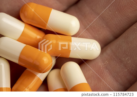 medical drugs in close-up on a blue background medical drugs in close-up on a blue background 115784723