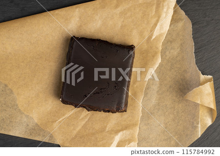 cottage cheese dessert covered with a thin layer of chocolate 115784992