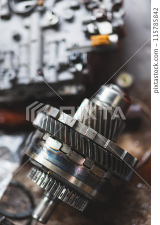 Closeup Motor Engine Clutch Gear, Auto Garage Motor racing part service workshop. vertical shot. 115785842