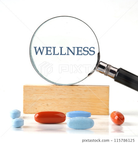 Wellness sign it manifested itself in a magnifying glass standing on a wooden bar. The aspect ratio of the photo is 1 to 1 Wellness sign it manifested itself in a magnifying glass standing on a wooden bar. The aspect ratio of the photo is 1 to 1 115786125