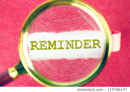 Business motivational inspirational concept. Reminder, text words through a magnifying glass under a torn piece of red paper 115786147