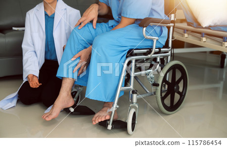 young asian physical therapist working with senior woman on walking with a walker young asian physical therapist working with senior woman on walking with a walker 115786454