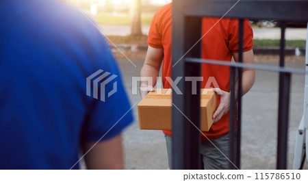 Asian delivery express courier young man use giving boxes to woman customer he wearing protective face mask at front home 115786510