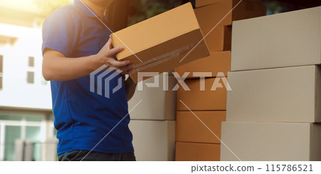 Asian delivery express courier young man use giving boxes to woman customer he wearing protective face mask at front home 115786521