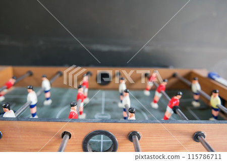 Closeup of soccer table miniature players in football shirts 115786711
