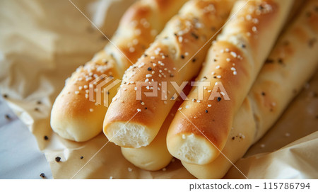 Freshly baked bread rolls on display. 115786794
