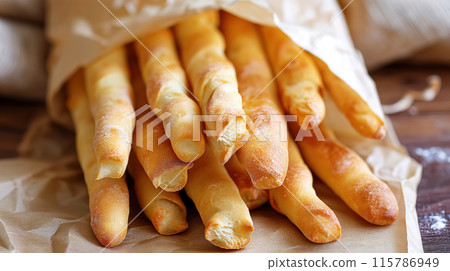 Fresh baguettes on wooden background. 115786949